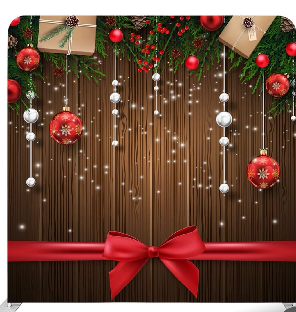 Rustic wood holiday photo booth backdrop with red ribbon