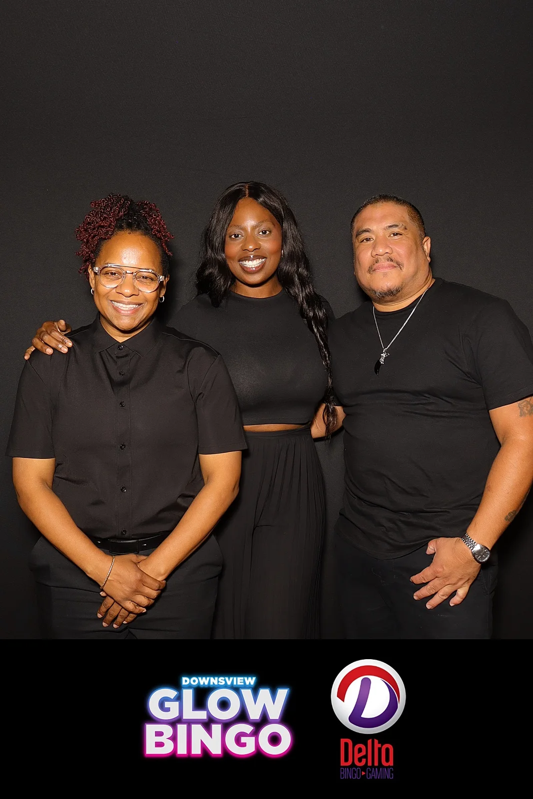 Three members of the JJ Rock Entertainment Group team posing together at Downsview Delta Glow Bingo