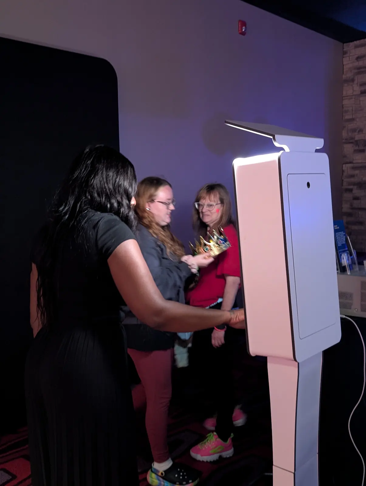 JJ Rock Entertainment team member assisting guests at the staffed photo booth