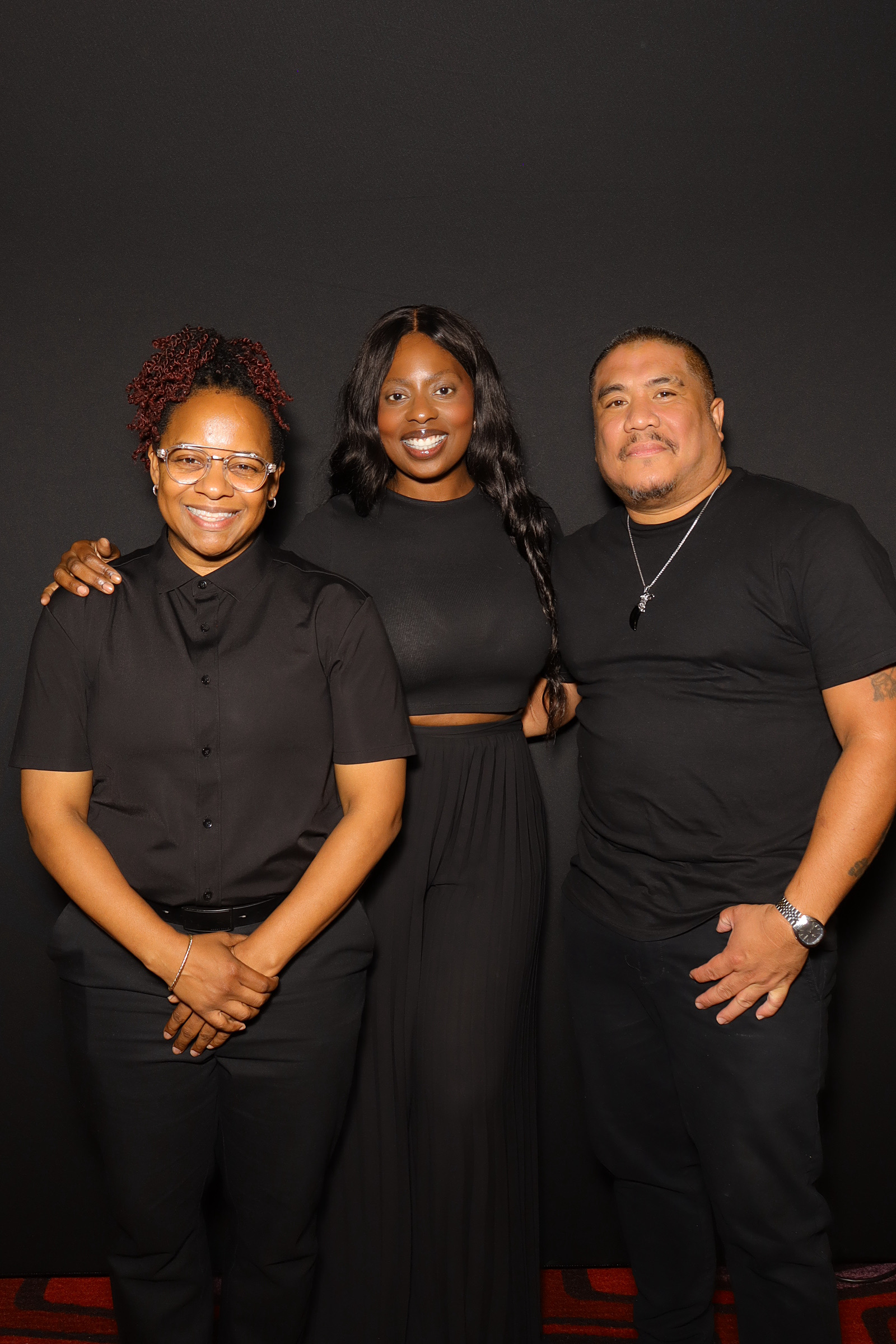 Three members of the JJ Rock Entertainment Group event team together before the corporate program