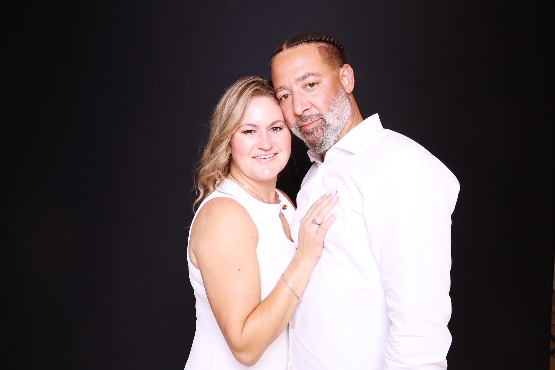 Wedding couple against a dark backdrop