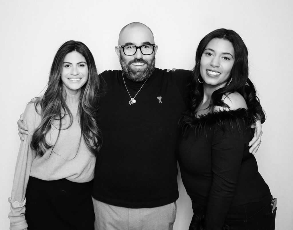 JJ Rock Entertainment Group – black and white digital photo booth portrait from a corporate holiday party in Toronto featuring festive Christmas-themed props and DJ entertainment services